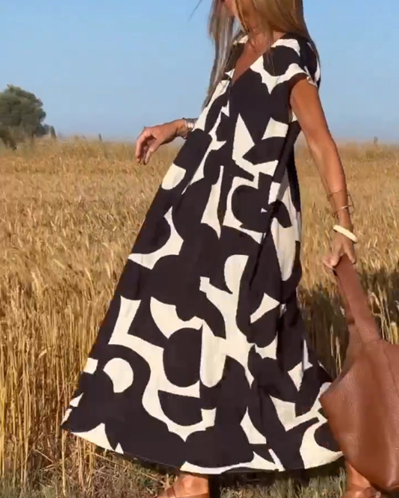 SITA - ABITO STAMPATO CON SCOLLO A V