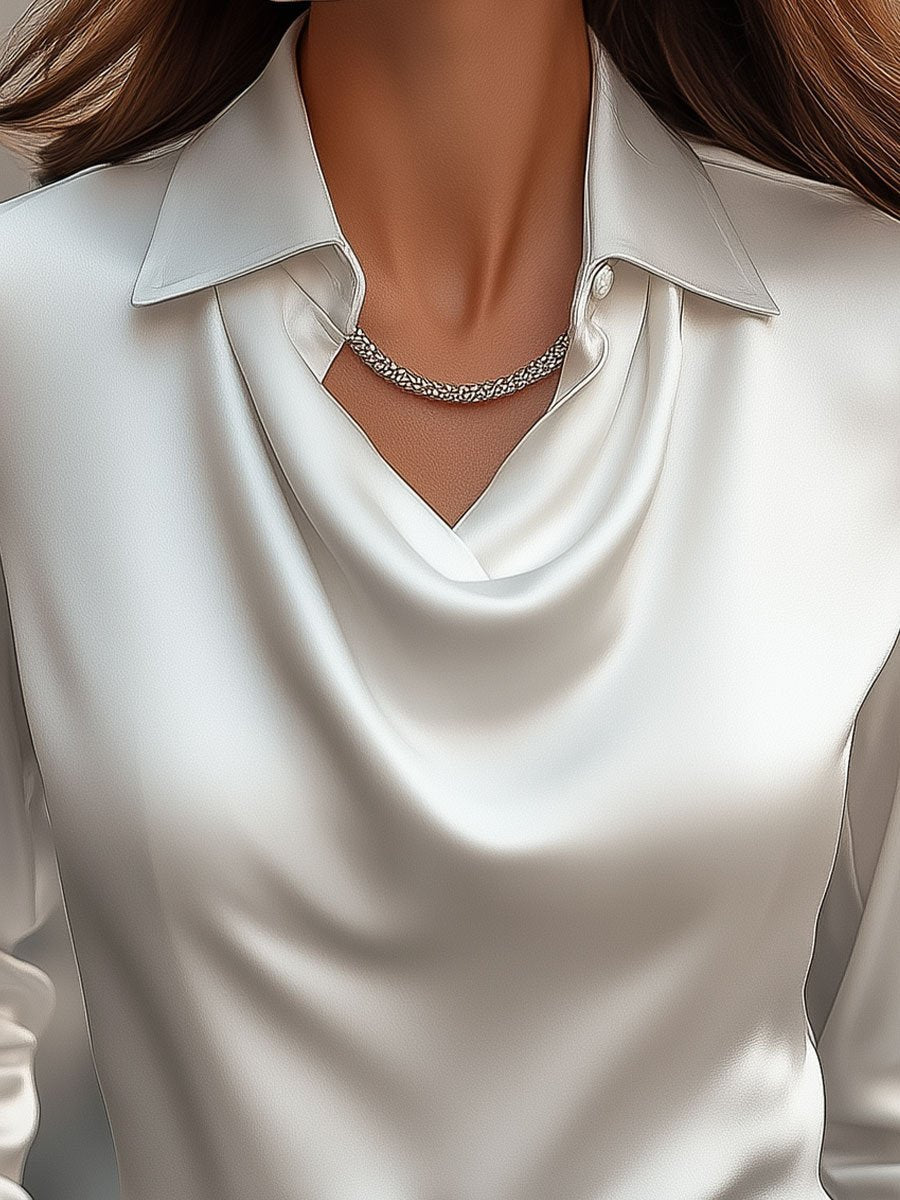 Camicetta elegante in raso con scollo a drappeggio